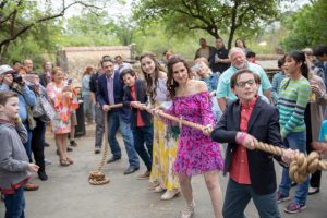 Rebecca Taylor and her family tug-of-war with a lion during Wild for Wishes 2019