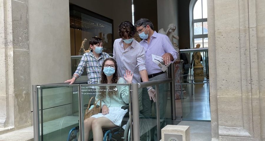 In a museum trying to maneuver a wheelchair elevator that did not work. Brian ended up carrying the wheelchair down a set of stairs while the boys held Rebecca. This happens all the time….